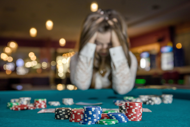Woman gambling at a poker table