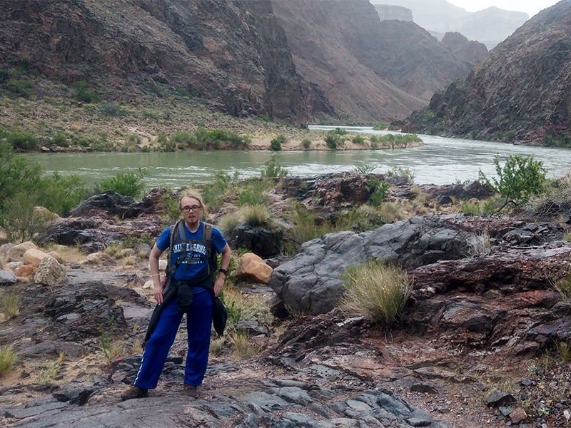 Bradley Smith standing along bank of Colorado River