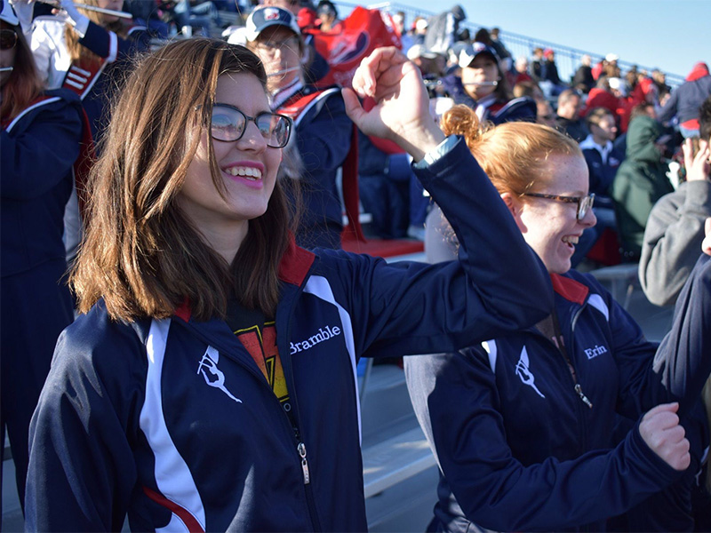 Peyton Bramble cheering from stands of Seth Grove Stadium