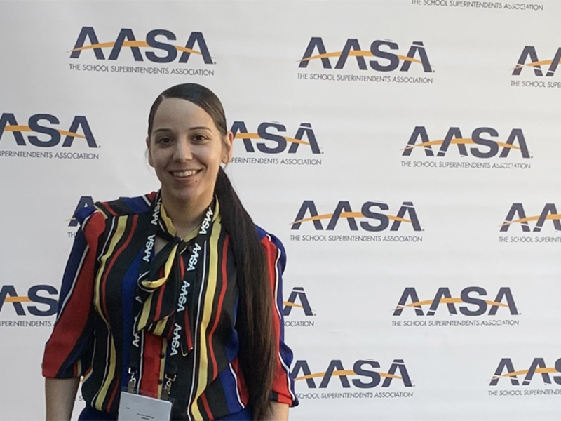 Samantha Neidlinger with AASA conference background