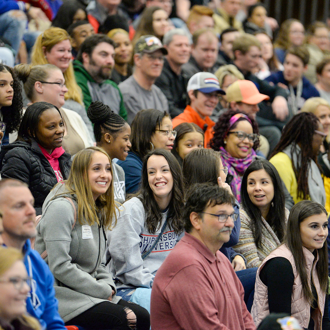 a crowd of newly admitted students sitting in a group