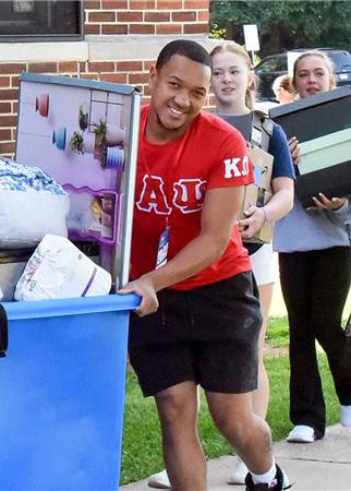 decorative - male student moving into the dorm