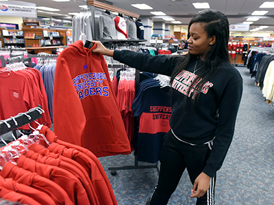 student shopping for sweatshirt