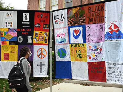 students viewing equity quilt