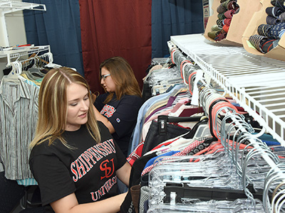 Students review available clothing