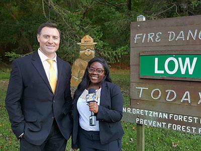 Student with newscaster