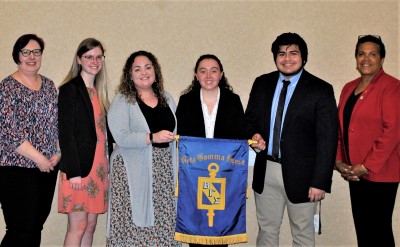 Group holding a banner