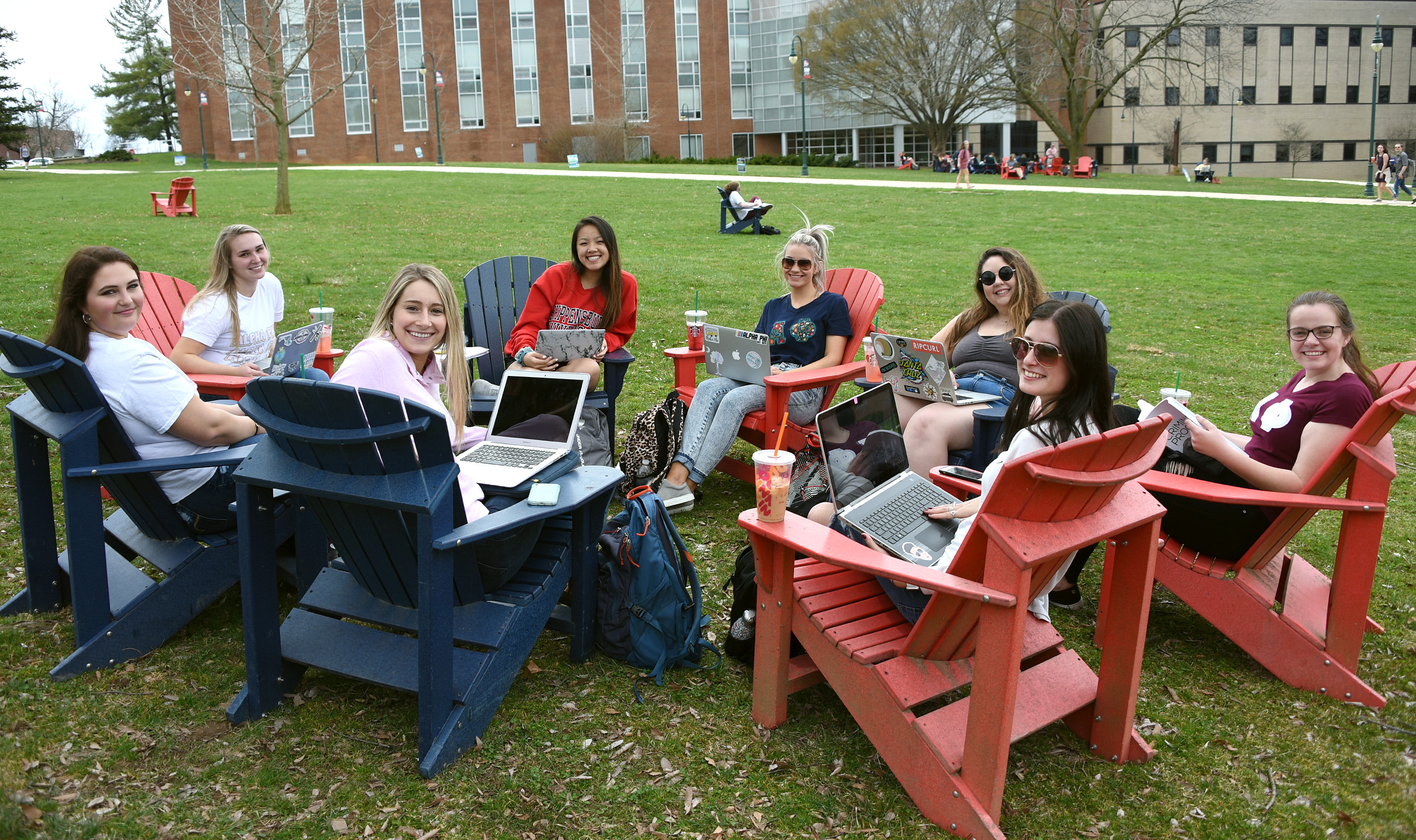 Female students studying outdoors