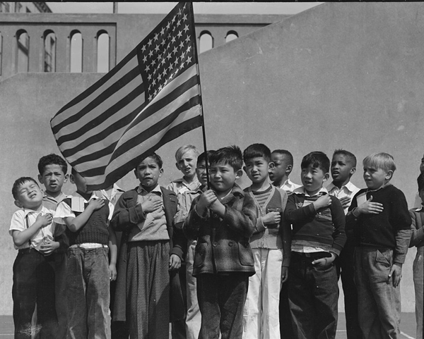 boys with flag reciting pledge