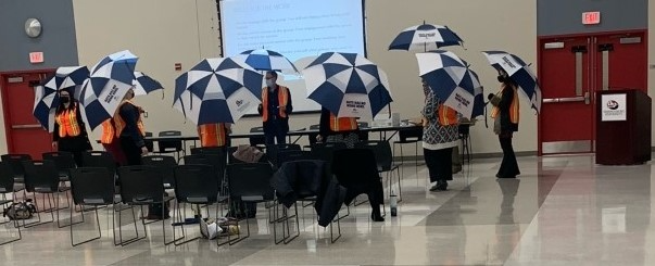 Peacekeepers group with umbrellas