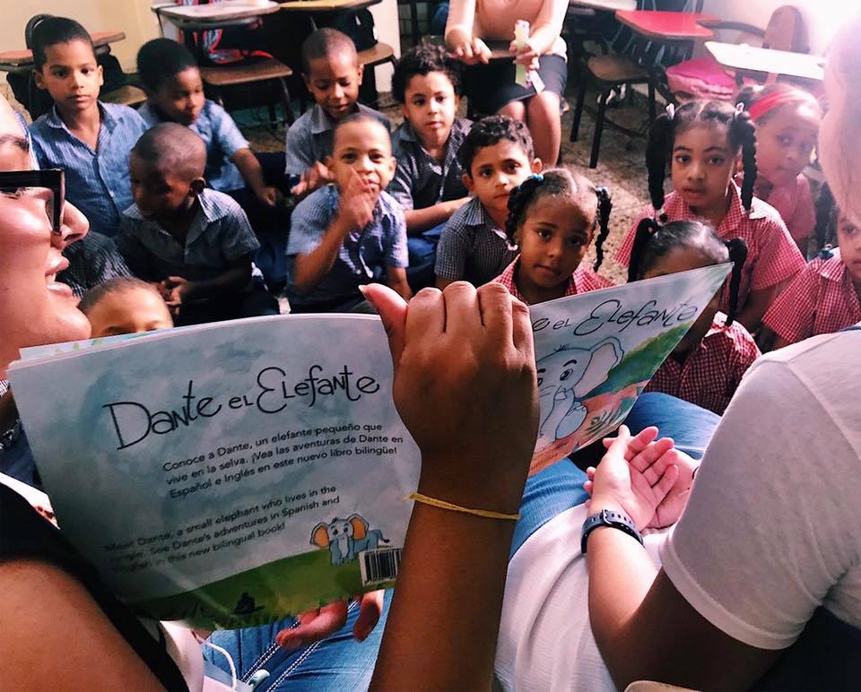 Honors alumna Nishi Natalia reading to students 